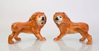 PAIR OF STAFFORDSHIRE POTTERY LIONS