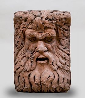 TERRACOTTA FOUNTAIN HEAD IN THE FORM OF A GREEN MAN