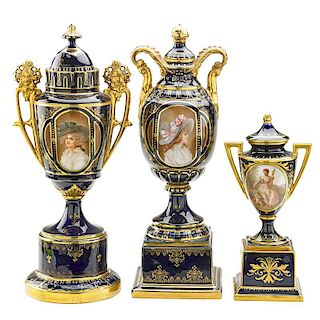 THREE ASSOCIATED PORCELAIN COVERED URNS