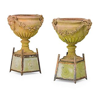 PAIR OF TERRA COTTA URNS ON STANDS