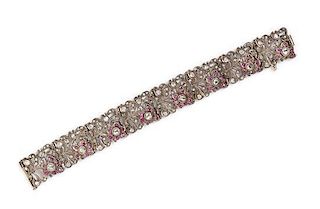 A Silver Topped Gold, Diamond and Ruby Floral Motif Bracelet, 24.40 dwts.