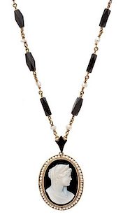 * A Victorian Yellow Gold, Onyx Cameo, Pearl and Enamel Lavalier Necklace, 11.90 dwts.