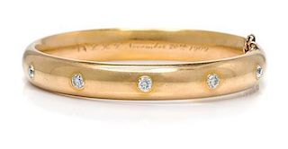 * An Art Nouveau 18 Karat Yellow Gold and Diamond Bangle Bracelet, Riker Brothers, 22.70 dwts.