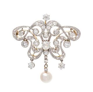 * An Edwardian Platinum Topped 18 Karat Yellow Gold, Diamond and Pearl Brooch, 8.30 dwts.