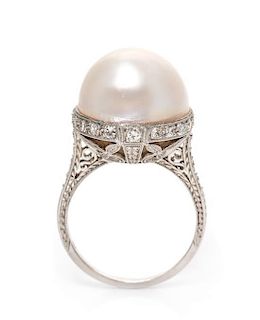 * An Edwardian Platinum, Mabe Pearl and Diamond Ring, 6.10 dwts.