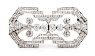 An Art Deco Platinum Topped Gold and Diamond Brooch, 9.50 dwts.