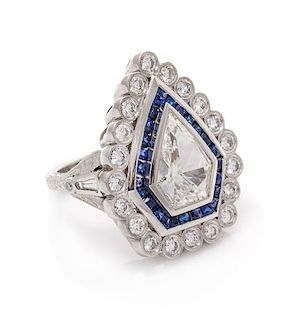 A Platinum, Diamond and Sapphire Ring, 15.40 dwts.