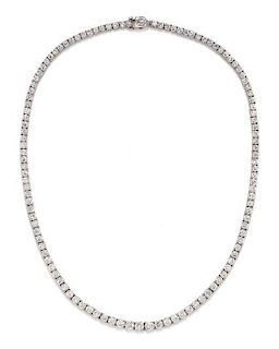 A Platinum and Diamond Riviere Necklace, 18.80 dwts.