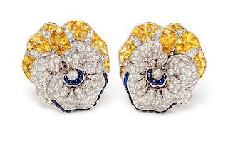 A Pair of 18 Karat White Gold, Diamond, Yellow Sapphire and Sapphire 'Pansy' Earclips, 23.80 dwts.