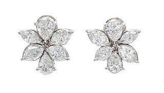 A Pair of Platinum and Diamond Cluster Earclips, 6.50 dwts.