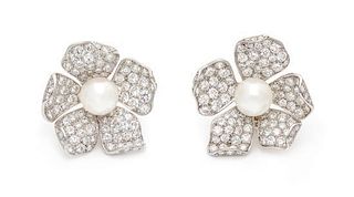 A Pair of Platinum, Diamond and Cultured Pearl Floral Motif Earclips, 14.40 dwts.