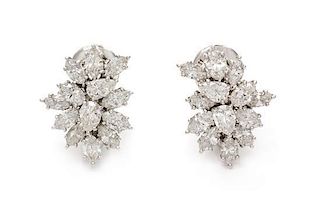 * A Pair of Platinum and Diamond Cluster Earclips, 7.90 dwts.