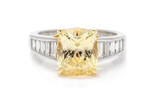 A Platinum, Yellow Gold, Yellow Sapphire and Diamond Ring, Richard Krementz, 6.00 dwts.