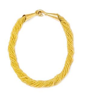A Yellow Gold and Multi Strand Yellow Sapphire Bead Torsade Necklace, 73.35 dwts.