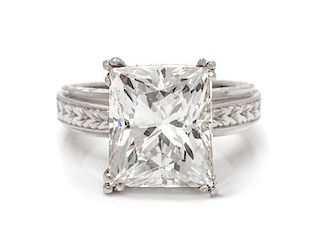 A Platinum and Diamond Ring, one princess cut diamond 10.03 cts, 18 round 0.09 cts. GIA Cert Number 6197093042 9.90 dwts.