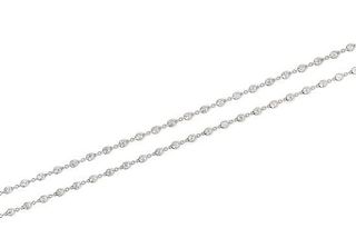 An 18 Karat White Gold and Diamond Station Necklace, 14.10 dwts.