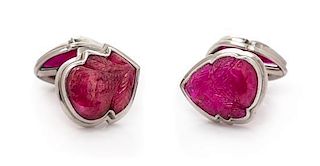 A Pair of Platinum, White Gold and Carved Ruby Cufflinks, 16.05 dwts.