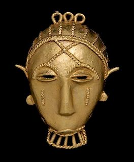 * An Akan Gold Alloy Pendant Mask, CÃ™te d'Ivoire/Ghana,