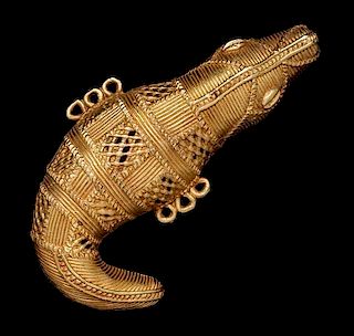 * An Akan Gold Alloy Crocodile Pendant, CÃ™te d'Ivoire/Ghana,