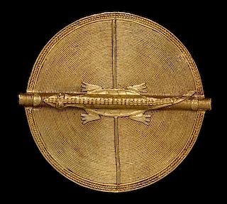 * An Akan Gold Alloy Crocodile Disk Pendant, CÃ™te d'Ivoire/Ghana,