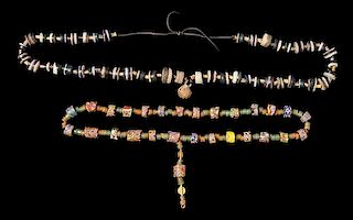 * A Collection of Akan Metal Alloy, Millefiori Glass and Glass Bead Necklaces, CÃ™te d'Ivoire/Ghana, consisting of a neckl