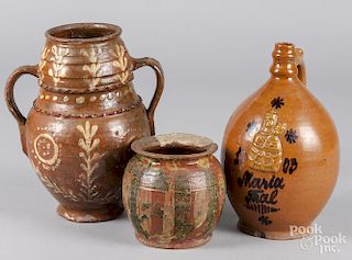 Redware jug with relief decoration of Mary