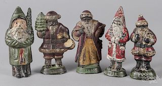 Five painted cast iron Santa Claus paperweights