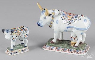 Two faince pottery cows