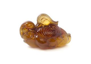 A Chinese Amber Carving of Mandarin Ducks, Width 3 3/8 inches.