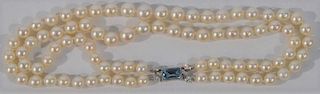 NO CREDIT CARDS FOR JEWELRY  Cartier pearl double strand necklace with 18 karat white gold clasp, signed Cartier and mounted