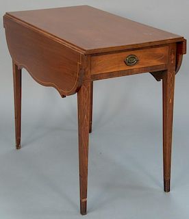 Federal mahogany pembroke table with shaped drop leaves having one drawer and line, panel, urn, and flower inlay, circa 1790.