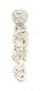 A Carved Porcelain Dragon Ruyi Scepter, After Wang Bingrong (1820-1860), Length 13 3/4 inches.