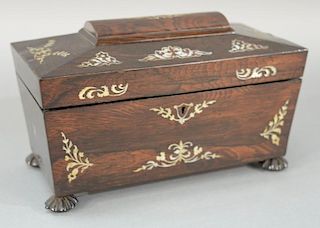 Rosewood tea box with carved compartments and center jar, case with mother of pearl inlay on carved feet. 
height 7 1/2 inche