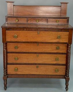 Sheraton mahogany and figured mahogany three over four drawer chest with spiral columns on turned legs, circa 1830. 
height 5