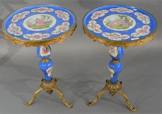 Pair of Sevres type porcelain top stands having round tops with brass trim on porcelain pedestals on brass tripod base. 
heig