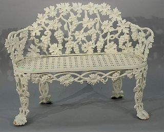 Iron Victorian bench having grape and vine motif and openwork seat. 
height 31 inches, width 44 inches 
Provenance: 
Property