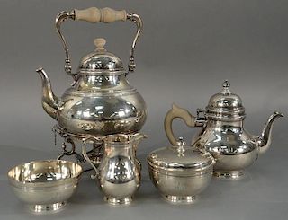 Five piece English silver tea and coffee set with tilting pot, tea pot, sugar, creamer, and waste bowl (monogrammed).  tiltin