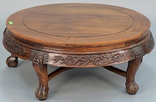 Chinese hardwood low table, round with dragon carved skirt, set on five carved legs and ending in paw feet, top with ghost fa