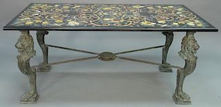 Pietra dura top table having stone inlaid birds, flowers, bugs, and scrolls, on bronze base with lion faces and large paw fee