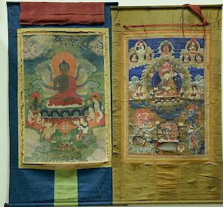 Two Tibetan Thangka including one with blue border having large central God and the other with gold border having large centr