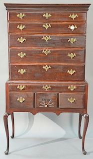 Queen Anne cherry high chest in two parts, upper portion with cornice molded top over five drawers on lower section with one