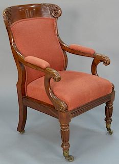Federal mahogany armchair having leaf carved top rail with carved hand rests, set on turned and fluted legs and ending in bra