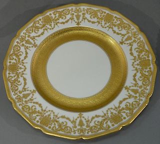 Set of twelve Royal Doulton service plates with raised gold, sold by Marshall Field & Co. Chicago.   diameter 10 1/2 inches <