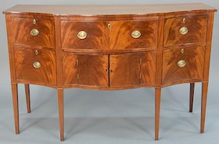 Federal mahogany sideboard with D shaped top over conforming case having drop front top center drawer over two doors flanked