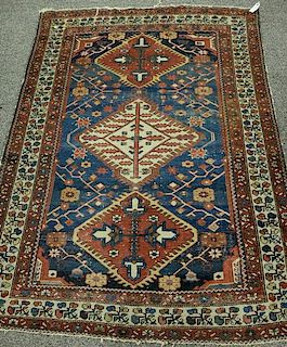Oriental throw rug (wear). 
4'6" x 6'3" 
Provenance: 
From the Estate of Faith K. Tiberio of Sherborn, Massachusetts