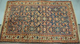 Oriental throw rug. 
4'4" x 6'6" 
Provenance: 
From the Estate of Faith K. Tiberio of Sherborn, Massachusetts