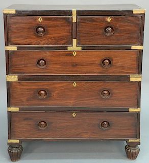 Campaign chest in two parts, upper section with two over one drawer on lower section with two long drawers with brass binding