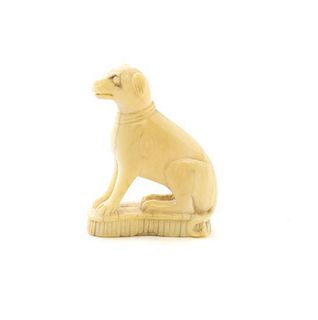A Carved Ivory Figure of a Dog, Height 1 3/8 inches.