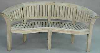 Teak tropical bench with curved back. 
width 67 inches