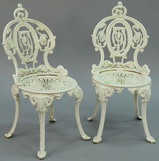 Pair of Victorian iron side chairs having pierced backs and seats, marked under seats: Atlanta Stove Works. 
height 31 inches